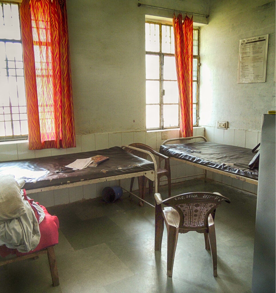 A delivery room with the WHO Safe Childbirth Checklist posted on the wall.